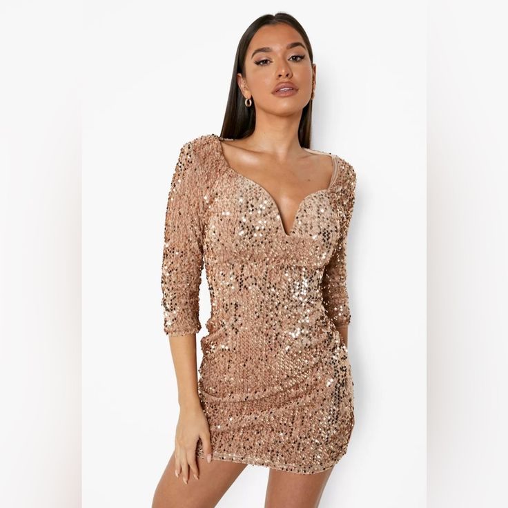 Get Ready To Sparkle This Holiday Season With This Party-Ready Sequin Bodycon Dress. Cut To A Mini Length With A V-Neck And Delicate Shoulder Detailing, This Dress Is The Perfect Way To Take Your Festive Outfit Game Up A Notch. Keep It Classic With All Black Accessories Or Pair It With Statement Jewelry For Extra Sparkle. Complete The Look With A Pair Of Strappy Heels And You're Ready For The Ultimate Christmas Night Out. Style: Bodycon Dressdesign: Plainfabric: Sequinlength: Minineckline: V Nec Party-ready V-neck Sequin Dress, Gold Bodycon Dress For Holiday Party, Glamorous Mini Dress For Festive Night Out, Fitted V-neck Sequin Dress For Festive Occasions, Fitted V-neck Bodycon Party Dress, Fitted V-neck Bodycon Dress For Party, Holiday V-neck Prom Mini Dress, Party-ready V-neck Mini Dress For Night Out, Festive Chic Fitted Mini Dress