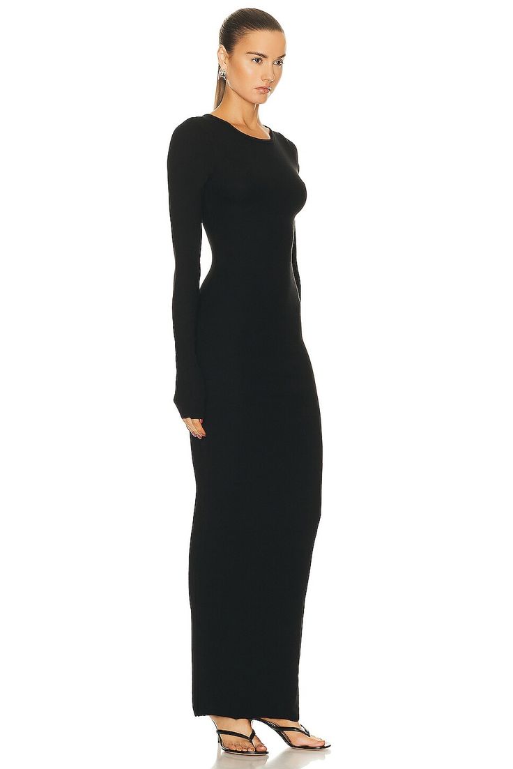 48% cotton 48% modal 4% spandex.  Made in USA.  Machine wash.  Unlined.  Pull-on styling.  Ribbed jersey fabric.  .  .  .  .  .  .  .  .  .  . Fitted Long Sleeve Pre-draped Maxi Dress, Black Long Sleeve Viscose Maxi Dress, Oversized Long Sleeve Black Maxi Dress, Black Knitted Long Sleeve Sweater Dress, Black Ribbed Long Sleeve Maxi Dress, Black Maxi Dress, Long Sleeve Maxi Dress, Jersey Fabric, Crew Neck