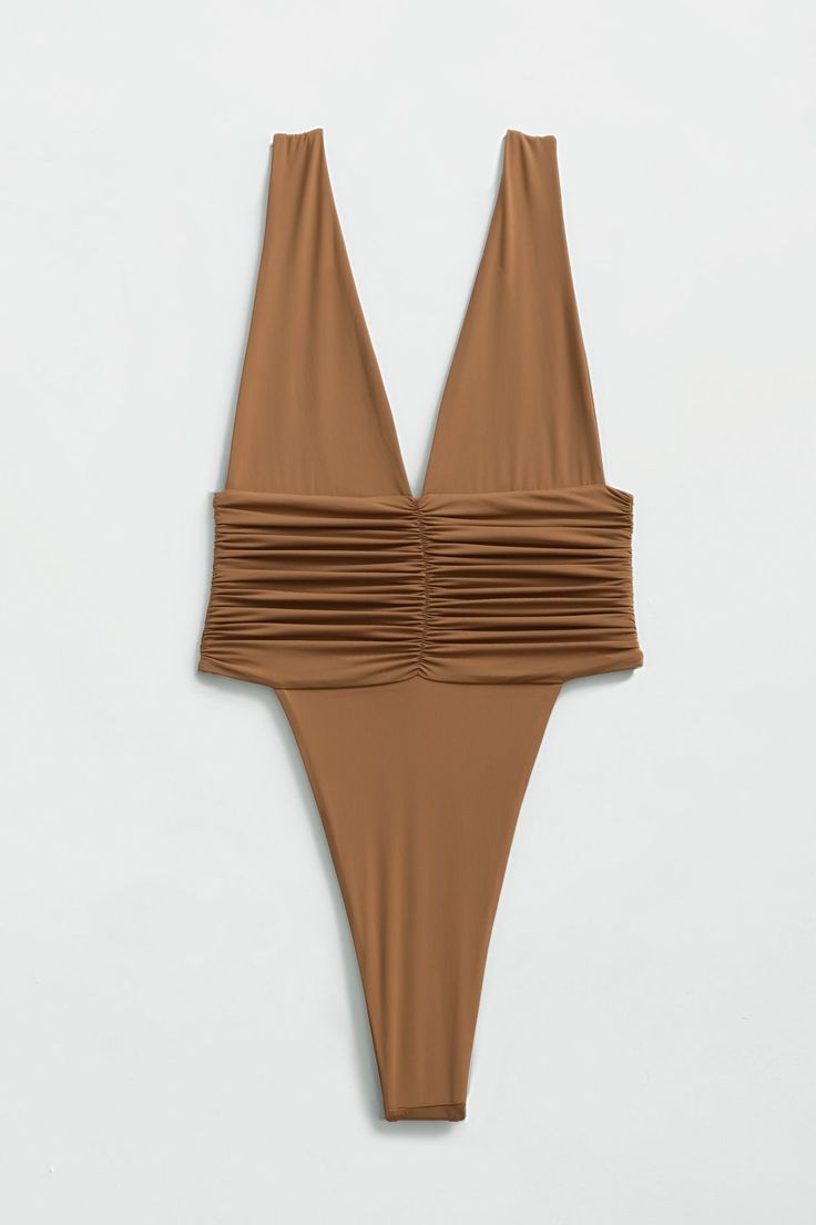 Our best-selling one-piece swimsuit! Equal parts sophisticated and sexy, the Echo One-Piece hugs your body and highlights your hips with a high-legged cut and minimal back coverage. The ruched side detail is met by moderate bust coverage and supportive shoulder straps. Super soft and super stretchy, this one-piece doubles as a bodysuit for an effortless beach-to-bar look. Just like an echo, you will want to repeat this purchase in every shade. Product description Minimal coverage front & back Do Party Swimwear With Ruched Sides, Party Swimwear With Ruched Sides And Stretch, High Cut Swimwear For Club And Summer, Summer Fitted Bodysuit With Ruched Back, Stretch Ruched Bodysuit For Swimming, Ruched Stretch Backless Swimwear, One-piece Ruched Bodysuit For Swimming, Party Swimwear With Ruched Back And Stretch, Ruched One-piece Swimming Bodysuit