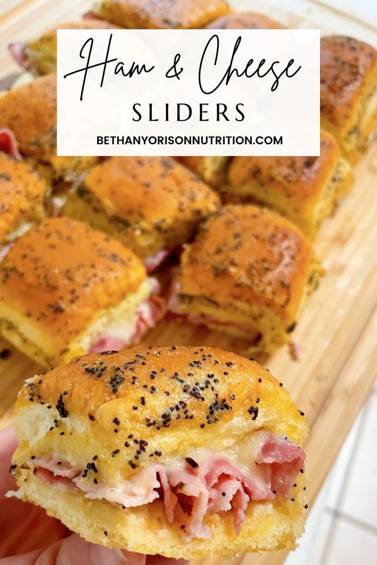 ham and cheese sliders on a cutting board with text overlay that reads ham and cheese sliders