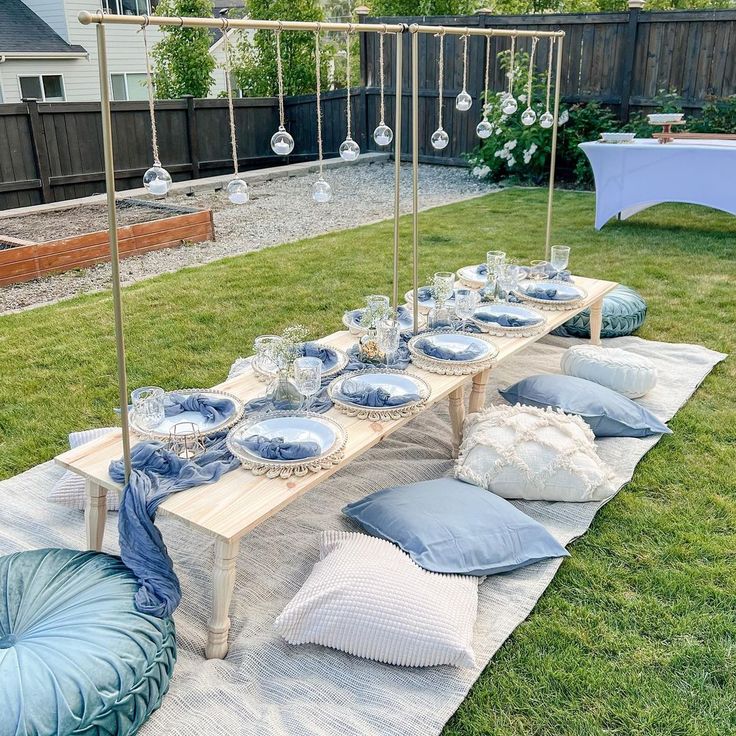 a table set up with blue and white plates