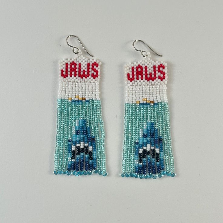 pair of beaded earrings with blue and red beads on white background, featuring the word jalis