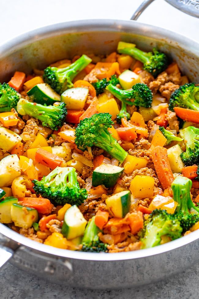 a pot filled with meat and vegetables on top of a table