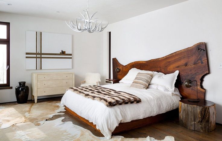 a bedroom with a large bed and wooden furniture in it's centerpieces