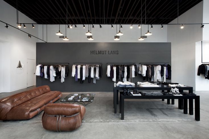 the clothing store is clean and ready for customers to use it's own leather furniture