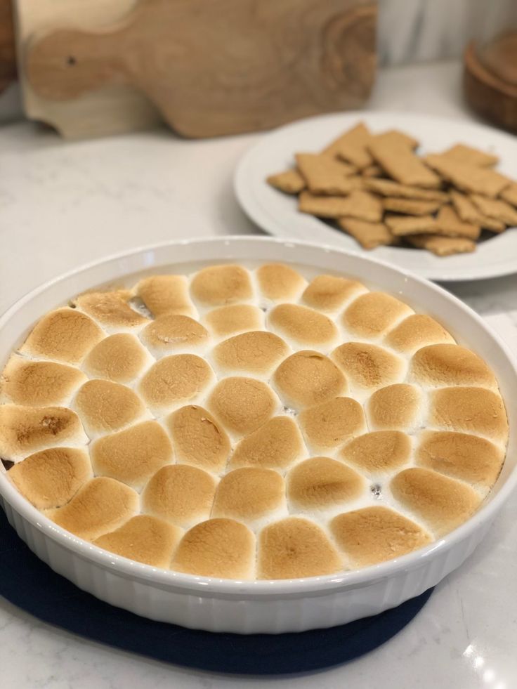 there is a pie on the table with other desserts in the backround