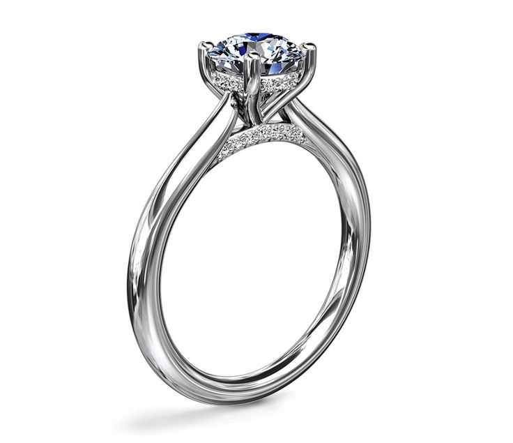 a white gold engagement ring with an oval center stone