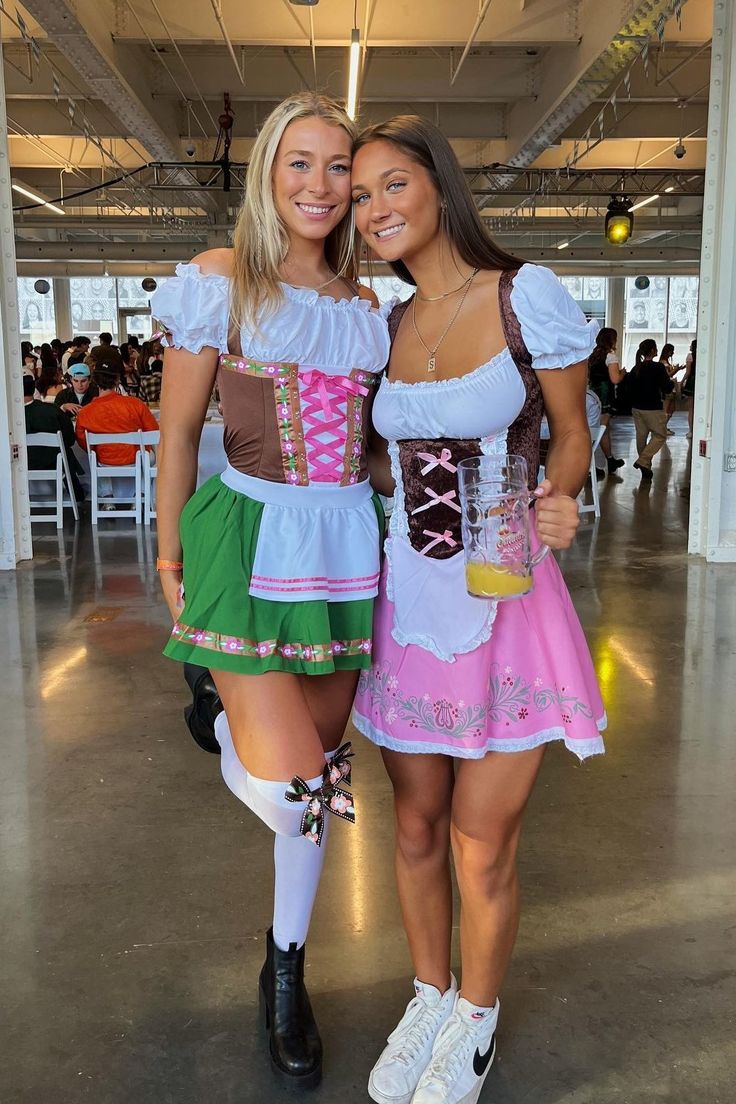 two women dressed in costume posing for the camera