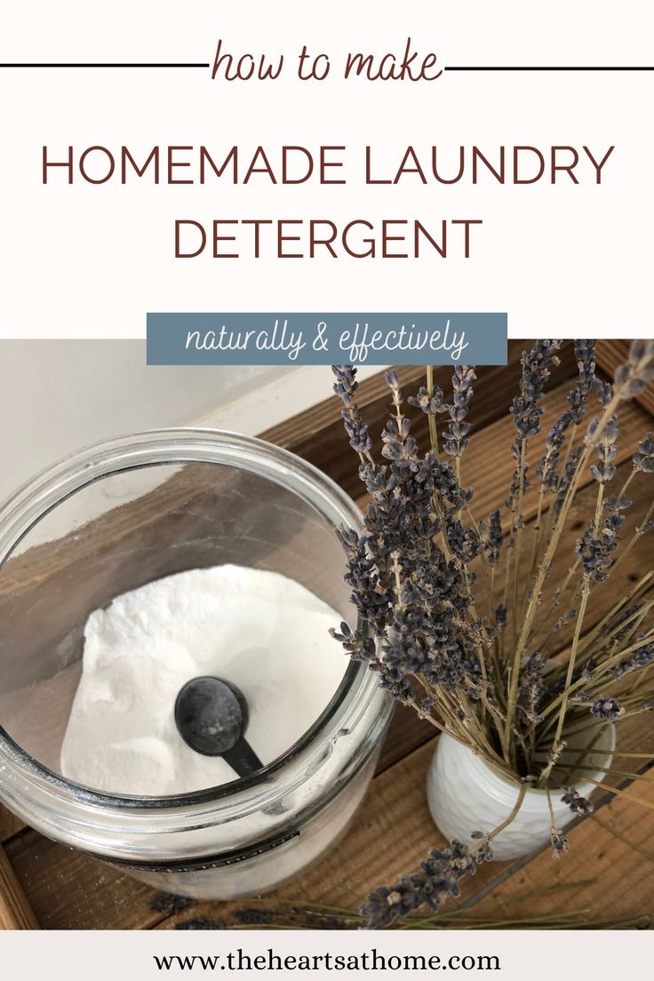 homemade laundry detergent in a jar with lavender sprigs on the side and text how to make homemade laundry detergent naturally & effectively