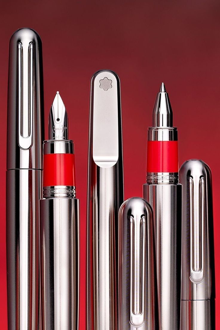 several different types of lipsticks are lined up on a red surface with the same color as they appear