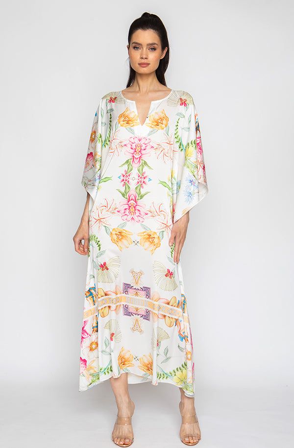 Bring out your inner flower in the Botanica Long Caftan. This gorgeous piece of apparel features delicate flowering patterns, giving you the freedom to show off your unique style. And the airy fabric won’t weigh you down, meaning you can wear your beauty around the clock! Bloom into something special with the Botanica Long Caftan. Printed short caftan Can be worn loose or cinched at the waist Comes with a matching belt as an option for styling Lusciously soft poly-silk blend for ease of care Mac Floral Print Flowy Maxi Cover-up, White V-neck Floral Print Kaftan, Silk Kaftan With Floral Print And V-neck, Elegant Floral Print Tunic Kaftan, Silk Floral Print Kaftan For Beach Cover-up, Spring Floral Print V-neck Kaftan, Elegant Floral Embroidered Kaftan For Spring, Bohemian Silk Kimono With Floral Print, V-neck Floral Print Tunic For Beach Cover-up