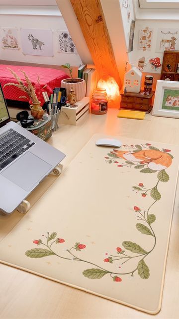 an open laptop computer sitting on top of a desk next to a mouse and keyboard