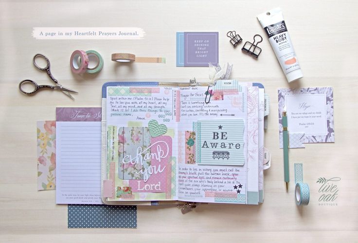 the contents of a scrapbook laid out on a wooden table with scissors, tape and other items