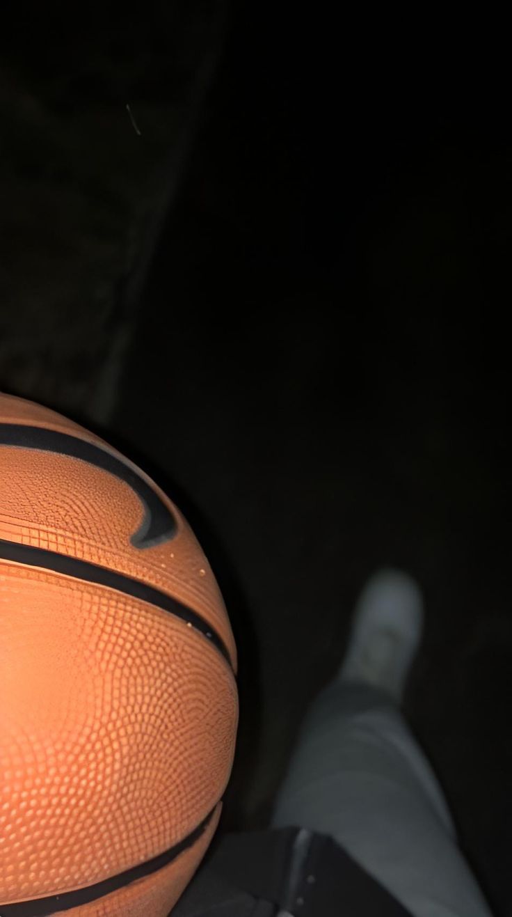 an orange basketball sitting on top of a table