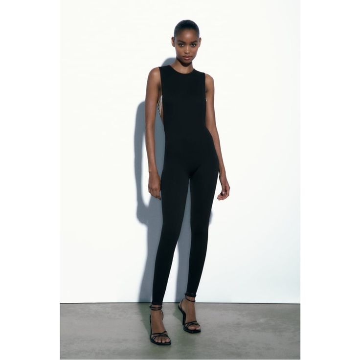 Full-Length Round Neck Sleeveless Jumpsuit; Jewel Appliqu Detail; **Brand New** Smoke Free/Pet Free Home Outer Shell 95% Polyamide. 5% Elastane Chic Stretch Overall Bodysuit, Chic Stretch Bodysuit Overall, Sleek Stretch Jumpsuits And Rompers For Summer, Sleek Stretch Summer Jumpsuits And Rompers, Sleek Sleeveless High-stretch Jumpsuits And Rompers, Sleek Sleeveless Stretch Jumpsuits And Rompers, Sleeveless Second-skin Elastane Unitard, Sleeveless Seamless Elastane Unitard, Elegant Sleeveless Seamless Bodysuit