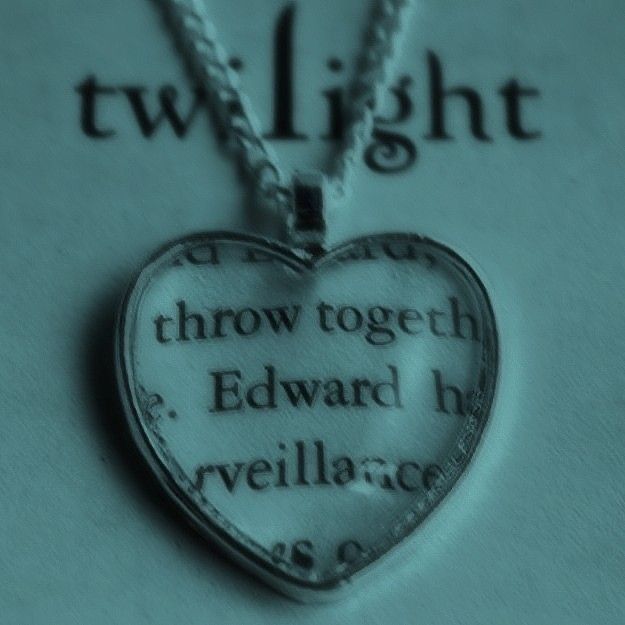 a heart shaped necklace with the words throw together edward h ryellacross on it