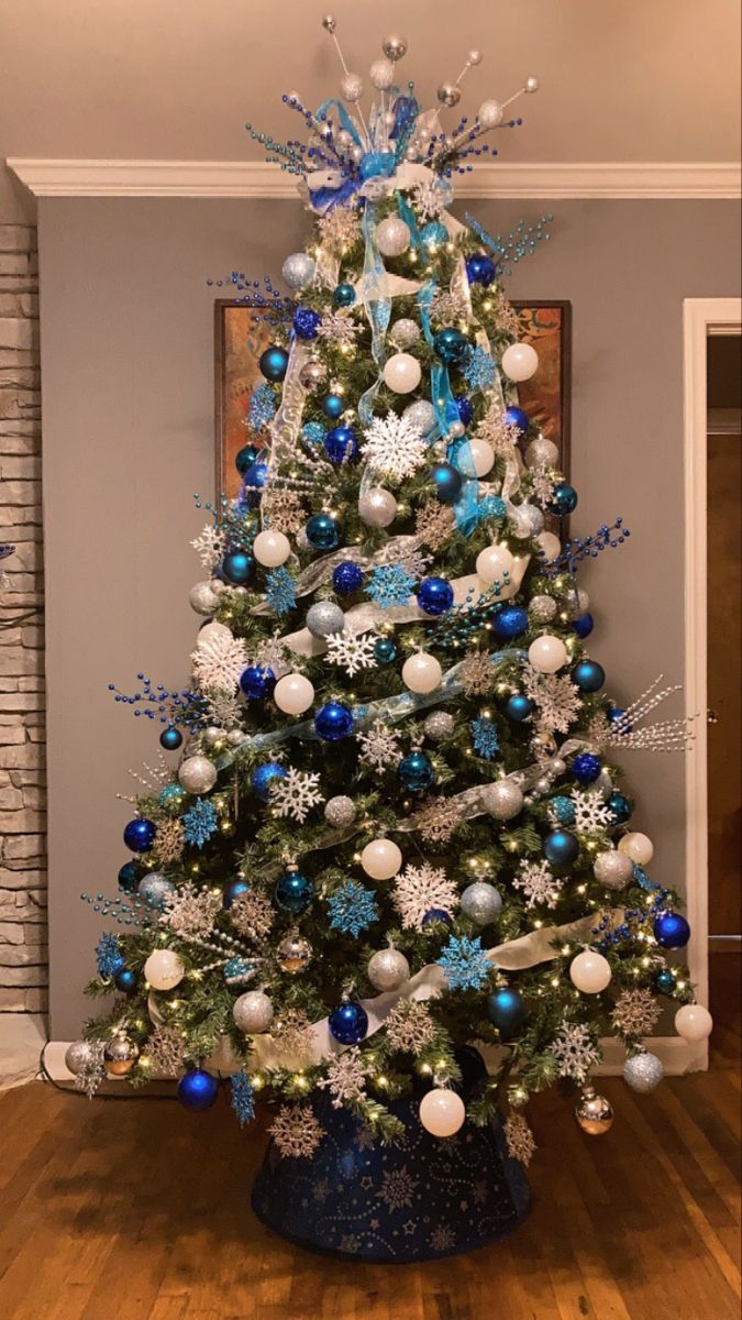 a christmas tree with blue and silver ornaments