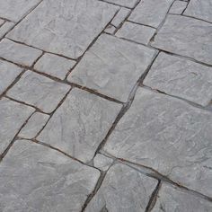 an image of a stone walkway that looks like it is made out of cement blocks