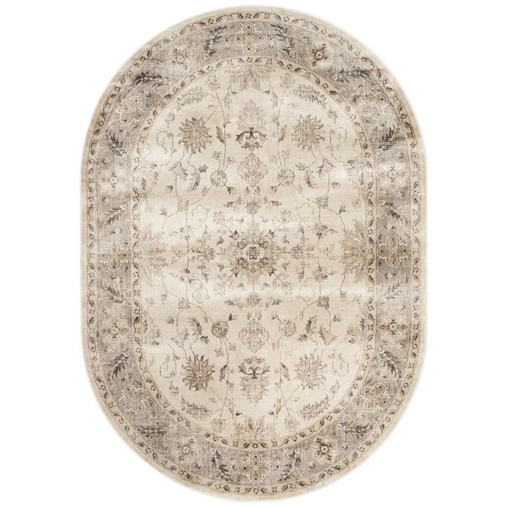 a round rug with an ornate design on the top and bottom, in beige tones