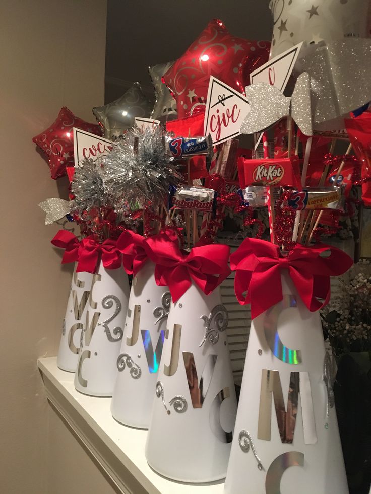 some red and silver decorations are on a shelf