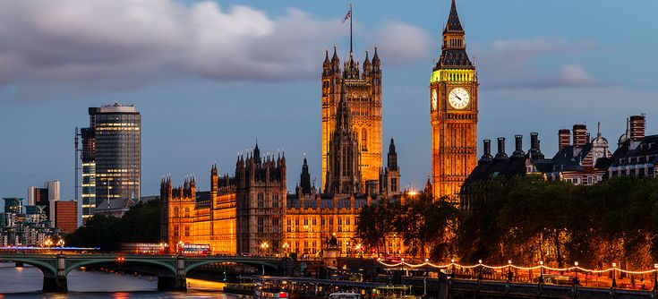 the big ben clock tower towering over the city of london, england at night time