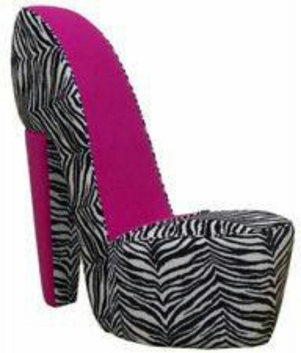 a zebra print high heeled shoe with pink accents