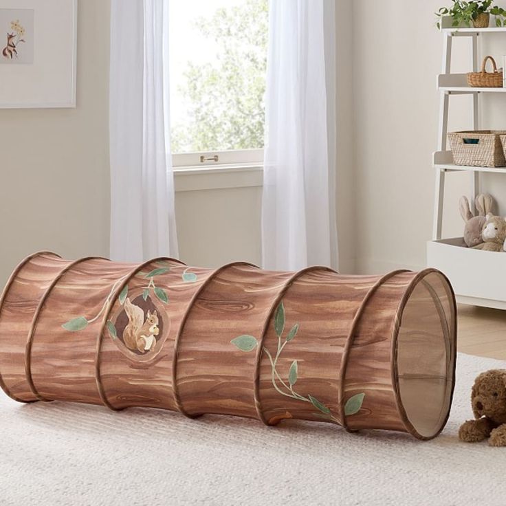 a child's room with four wooden barrels on the floor