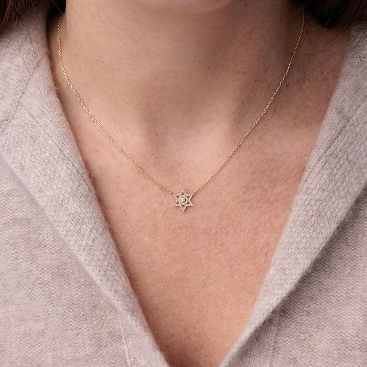 Made from 14k yellow gold, this necklace features a beautiful Jewish star charm that is adorned with pavé-set diamonds. This Magen David charm measures approximately 1/2' and is soldered on a fine 14k yellow gold cable chain (16' long with an extender at 18'). The combination of gold and diamonds creates a luxurious and eye-catching look that is sure to make a statement. The intricate design of the star of David adds a touch of elegance and symbolism to this necklace, making it a meaningful piec Jewish Star Necklace, Gold Ball Chain, Star Of David Necklace, The Star Of David, Jewish Star, Necklace Making, Diamond Star, Star Of David, Star Charms