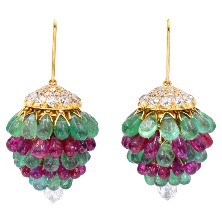 Art Deco Ruby, Emerald, and Diamond Chandelier Earrings. 18k yellow gold cap of the earrings is set with old european cut diamonds. Suspended from underneath are cabochon emeralds and rubies. Accented with a diamond ball on the bottom. Measuring approximately 50mm x 30mm Weight: 45 grams Ear Tops, Diamond Chandelier Earrings, Diamond Chandelier, Gold Cap, Lotus Jewelry, Ear Chain, Antique Jewellery Designs, Earrings For Sale, Jewelry Design Inspiration