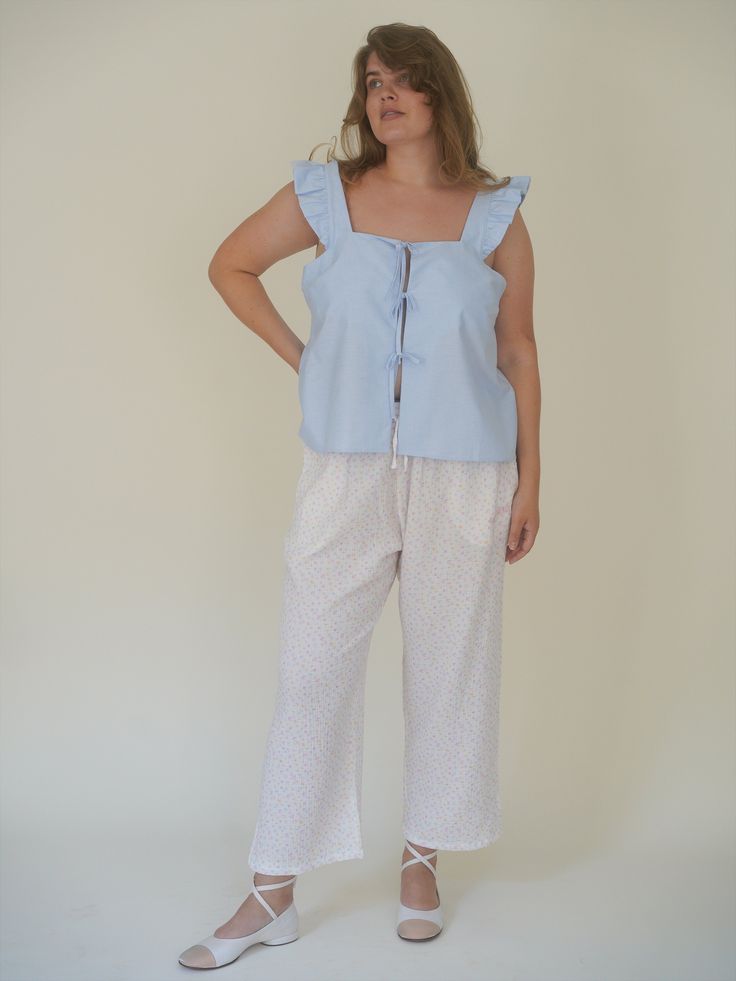 A relaxed and airy pair of ankle length pants, made in a super soft organic cotton muslin fabric. The drawstring waist can be placed either high- mid- or low waisted according to your preference. Designed for warm days, perfect to either match with a Breezy shirt in the city or together with a matching Muslin Shirt or Muslin Strap Top as a lounge set. Effortless Summer Loungewear Pants, Summer Cotton Pants For Daywear, Comfortable Spring Pants For Relaxation, Comfortable Pants For Relaxation And Spring, Spring Relaxation Comfortable Pants, Cotton Lounging Pants For Spring, Relaxation Cotton Straight Pants, Cotton Pants For Spring Lounging, Cotton Pants For Summer Relaxation