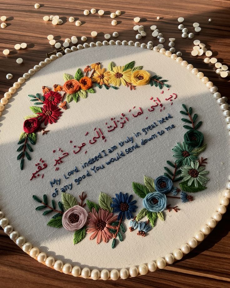 a birthday cake decorated with flowers and writing on it's side that says, happy birthday