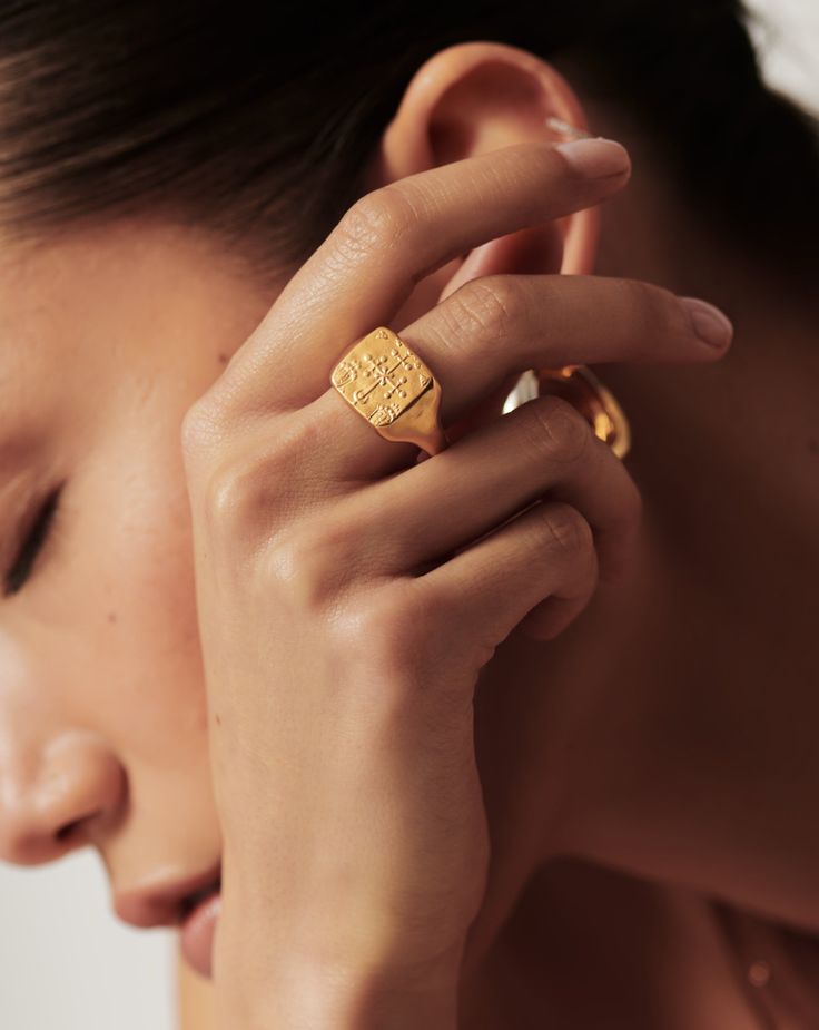 Lucy Williams Byzantine Coin Signet Ring | 18ct Gold Plated. This Ancient Byzantine-Inspired Signet Ring Features a Textured Square Coin Motif on Its Top. Wear Solo or Style with Other Simple Bands for a Contrasting Ring Stack. Metal: 18Ct Recycled Gold Plated on Brass Dimensions: 13mm X 13. 5mm Weight: 7. 2g Product Code: Lwa-G-R3-Ns Byzantine Engraved Yellow Gold Rings, Byzantine Yellow Gold Engraved Rings, Byzantine Style Engraved Yellow Gold Ring, Byzantine Yellow Gold Engraved Signet Ring, Yellow Gold Byzantine Signet Ring For Anniversary, Byzantine Yellow Gold Signet Ring For Anniversary, Byzantine Style Open Ring Jewelry As A Gift, Luxury Hammered Jewelry Ring, Formal Byzantine Gold Signet Ring