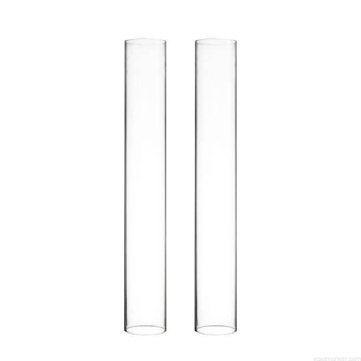 two clear vases sitting next to each other on a white surface with no one in it