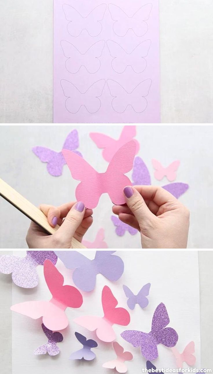 someone cutting out paper butterflies with scissors