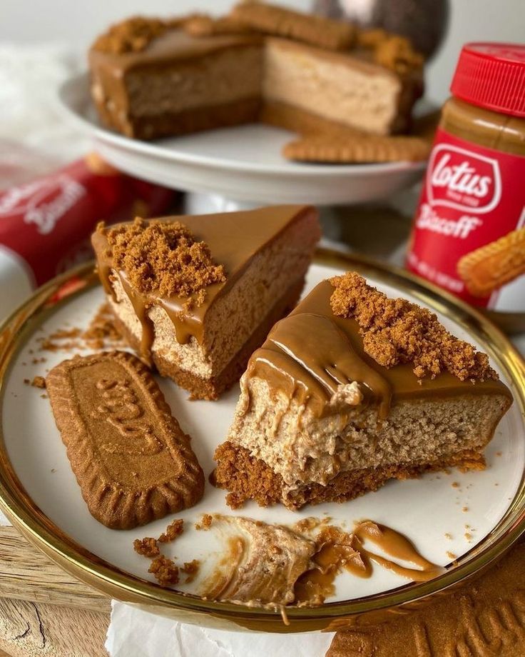 several pieces of cake on a plate with peanut butter and graham crackers next to it