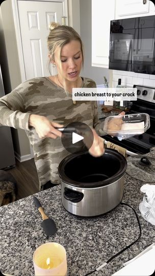 a woman is cooking in the kitchen with an appliance on her counter top