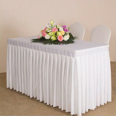 a white table with flowers on it