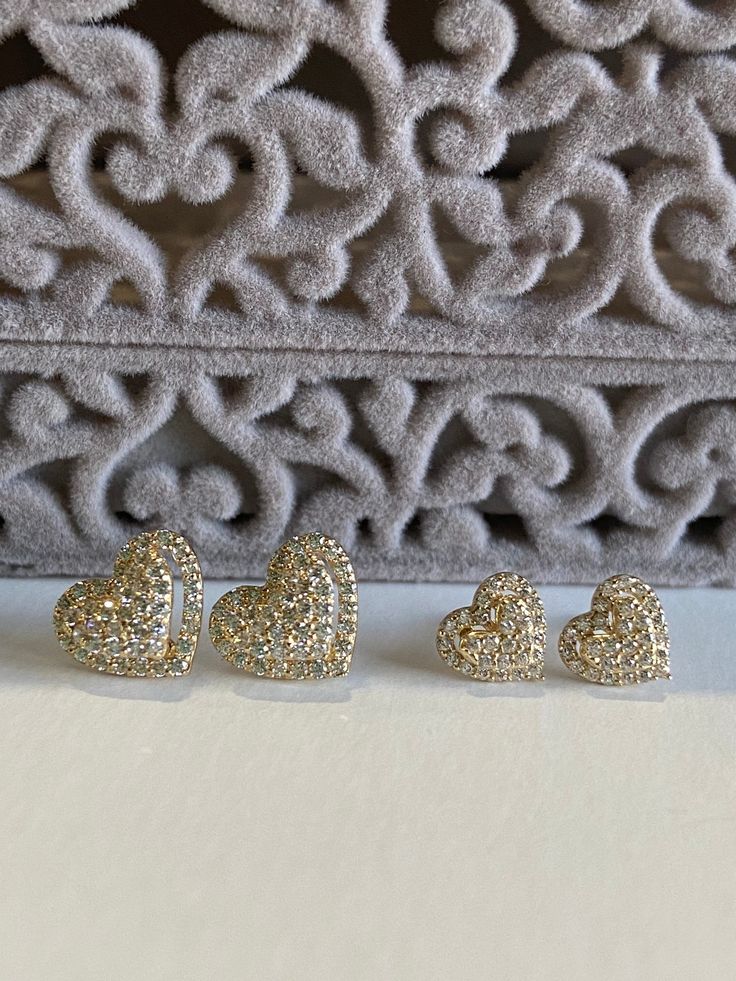 These gorgeous heart earrings are made of 14K solid gold with sparkling simulated diamonds. They have screw back closures and come in two sizes: 6.5mm and 9mm width. ▬ All jewelry pieces are sent in a gift box ♥♥ ▬ Our shipping and return policies: ~ Items will be shipped Free via USPS First Class Mail. We gladly accept returns, exchanges, and cancellations ~ Contact us within: 3 days of delivery ~ Ship items back within: 7 days of delivery ~ Request a cancellation within: 24 hours of purchase T Gold Diamond Heart Earrings For Wedding, Double Heart Cubic Zirconia Earrings, Cubic Zirconia Double Heart Earrings, Valentine's Day Open Heart Cubic Zirconia Earrings, Gold Heart Cut Diamond Earrings, Valentine's Day Heart Pendant Cubic Zirconia Earrings, Gold Double Heart Diamond Earrings, Gold Heart Earrings With Diamond Accents For Wedding, Heart-shaped Earrings With Sparkling Stones For Wedding