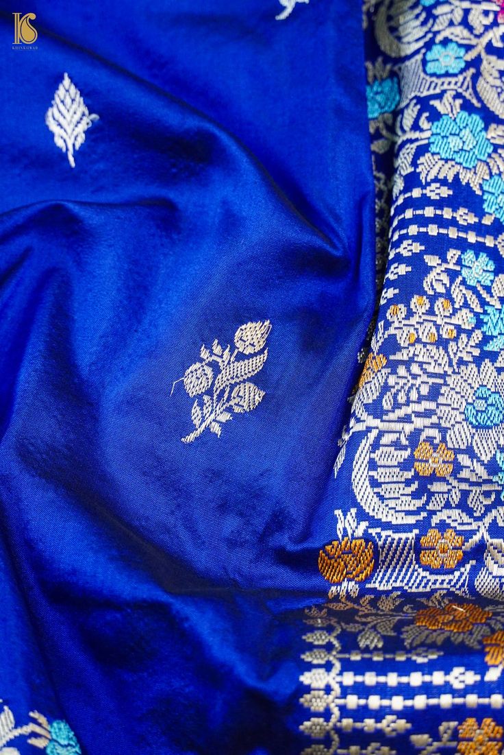 Indulge in the allure of Khinkhwab's Katan Silk Kadwa saree. This exquisite piece features the classic Katan silk weave with intricate Kadwa work, creating a luxurious texture and captivating design. Elevate your style with the timeless charm and craftsmanship embodied in this beautiful saree. Traditional Silk Pre-draped Saree For Diwali, Traditional Blue Silk Pre-draped Saree, Blue Raw Silk Blouse Piece With Traditional Patterns, Ceremonial Traditional Shawl, Elegant Tussar Silk Shawl With Traditional Patterns, Silk Saree Shawl Handloom, Elegant Shawl In Tussar Silk With Traditional Patterns, Traditional Ceremonial Shawl With Zari Work, Ceremonial Pashmina Shawl With Zari Work For Festive Occasions