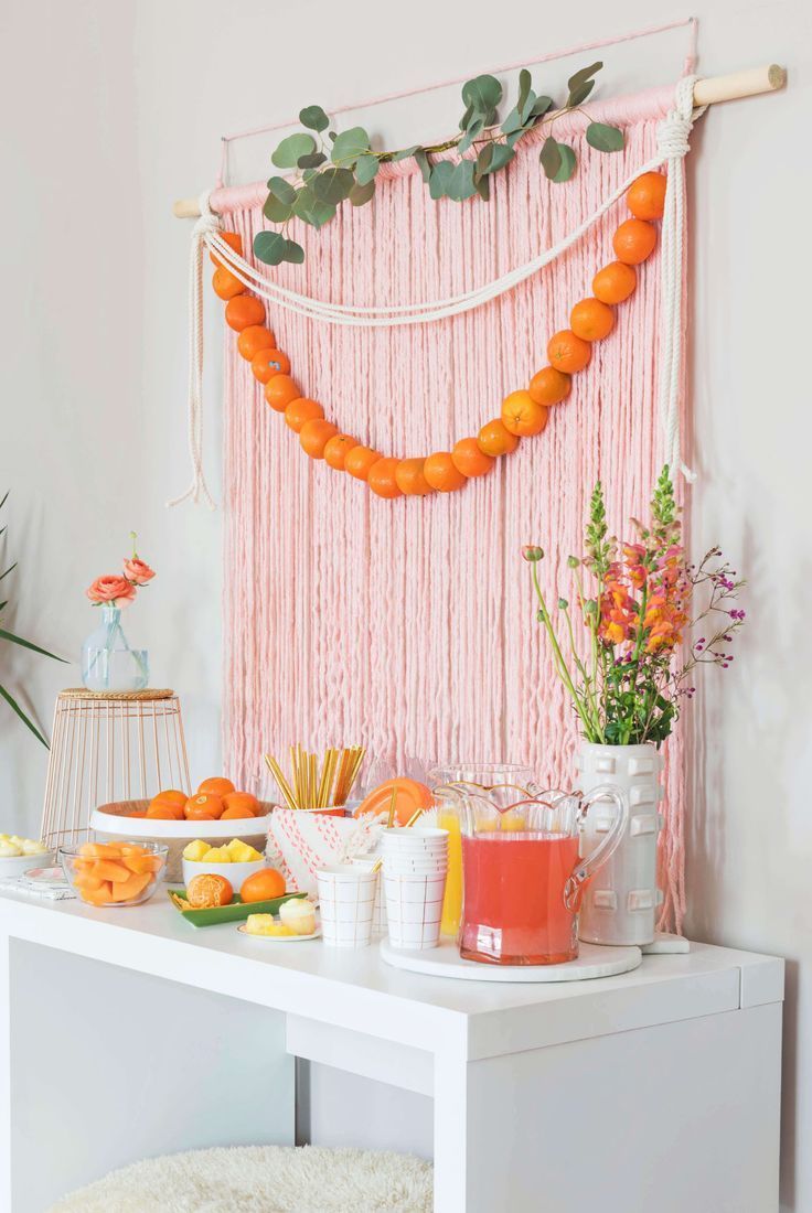 an image of a table with oranges on it and the words, obsesed with this diy brunch backdrop by @ abeautifulimess