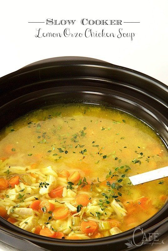 slow cooker lemon or chicken soup in a crock pot with a ladle