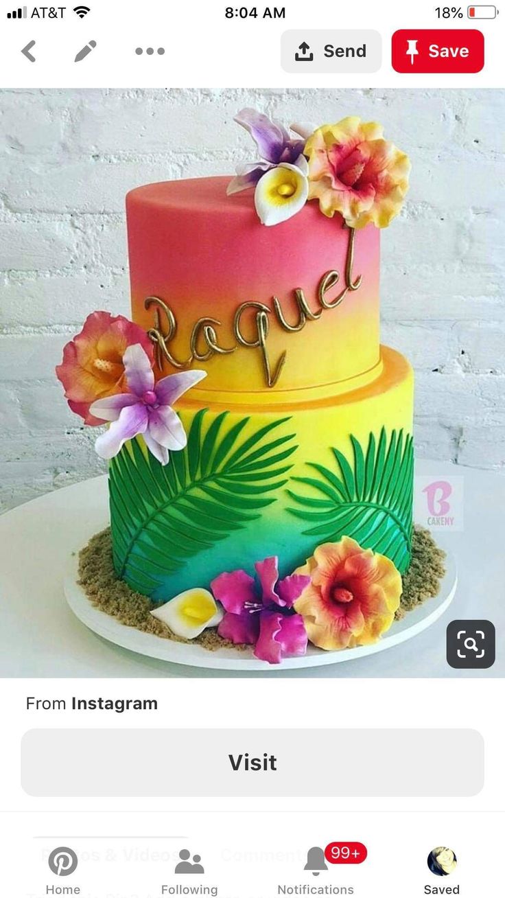 a colorful cake with flowers on top and the words rappel written in cursive writing