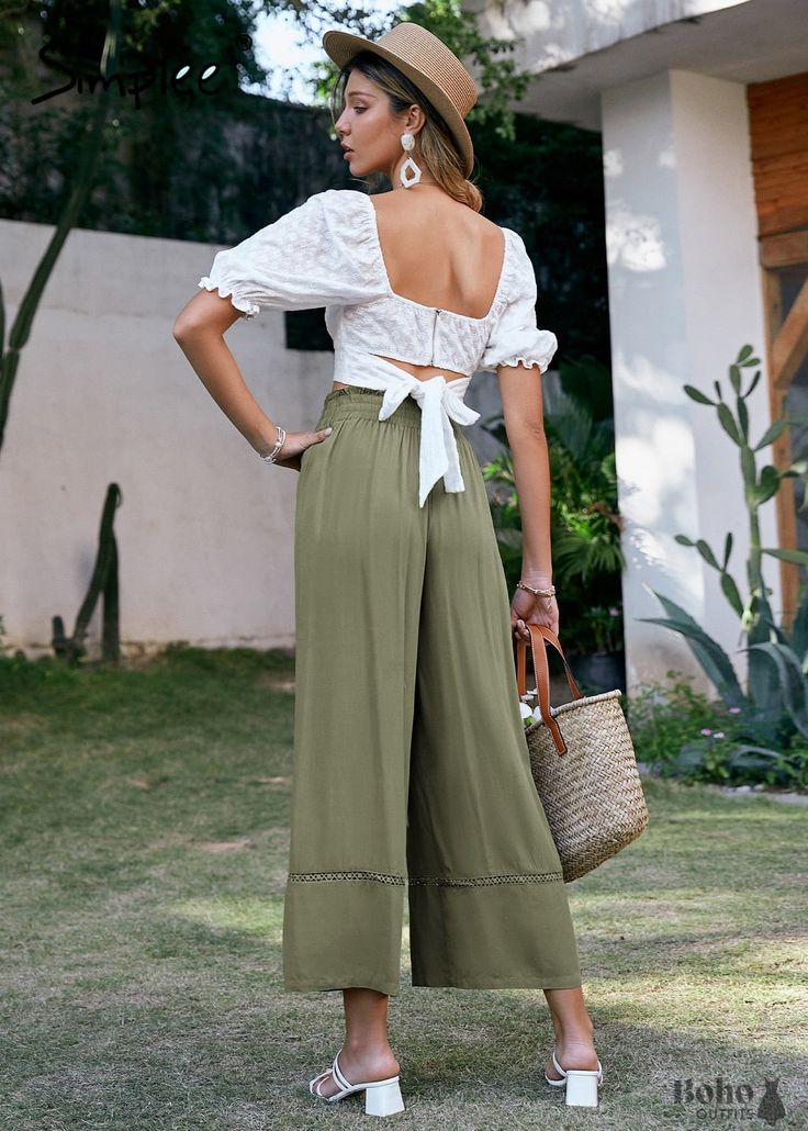 All size women's khaki green bohemian flare pants These khaki green All Size Boho Flare Pants can be worn casually with a crop top and sandals or elegantly with a stunning blouse and heels. These pants are definitely in style right now, with their high waist, tassel-tassel drawstring, and openwork embroidery. Fabric: viscoseFit: wide legDetails: stretchy waistband, drawstring with tassels, openwork embroiderySeason: spring, summer Collections: Bohemian Bottoms, Boho Pants Bohemian Flare Pants, Boho Flare Pants, Boho Bottoms, High Waist Wide Leg Pants, Boho Pants, Boho Green, Green Pants, Wide Leg Pant, Elastic Waist Pants