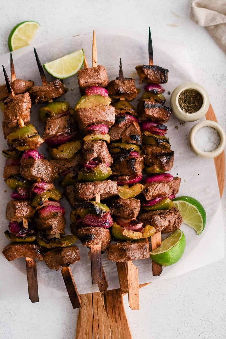 skewered meat and vegetables on wooden skewers