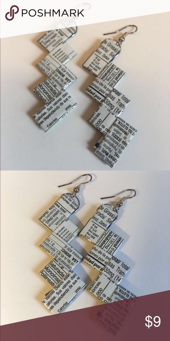 the book page earrings are made out of books and have been folded into small squares