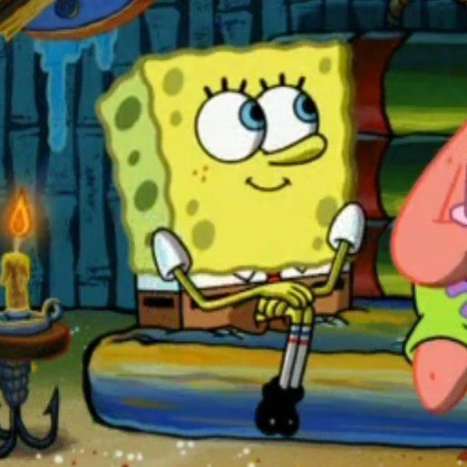 spongebob is sitting on the couch with his head in his hands