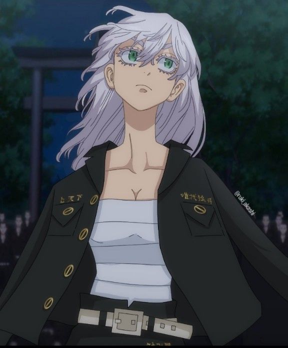 an anime character with white hair and green eyes wearing a black jacket in front of trees