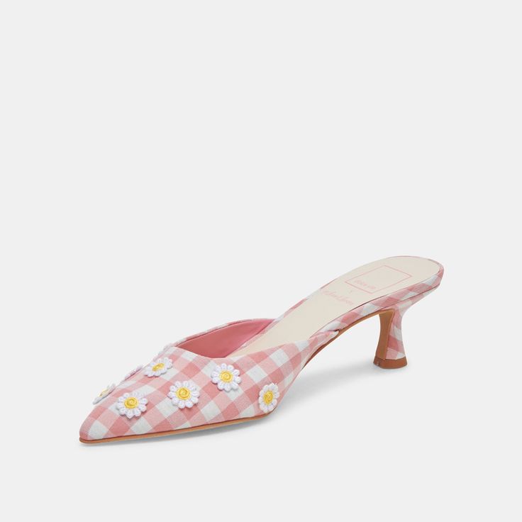 Your warm weather wardrobe needs a little whimsy and a lot of charm. From our For Love & Lemons collab, LILOU is a kitten-heeled mule featuring a classic gingham pattern embellished with dainty daisies. Textile Upper Rubber Outsole Synthetic Lining + Sock 2" Heel Height Imported White Feminine Kitten Heels For Spring, Feminine Spring Kitten Heels With Low Heel, Chic Pink Kitten Heels For Spring, Pink Feminine Kitten Heels For Spring, Feminine Kitten Heels For Spring, Heeled Mule, Heels White, Wardrobe Needs, Gingham Pattern