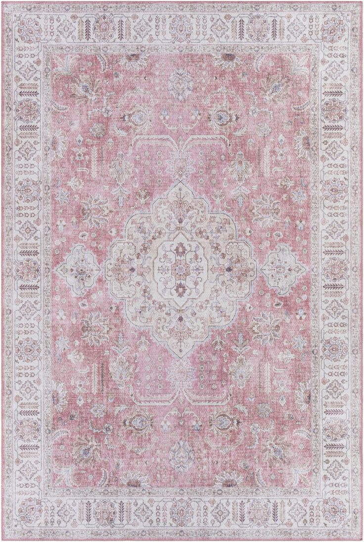 a pink and white rug with an ornate design