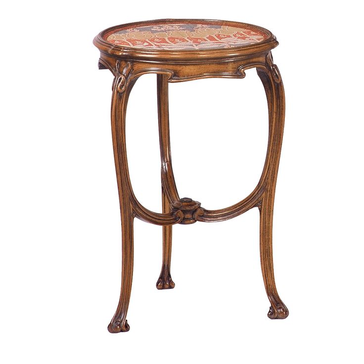 an ornately decorated wooden table with red and orange designs on it's sides